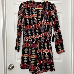 Brand new never worn . One piece, Long sleeve shorts romper with pockets.